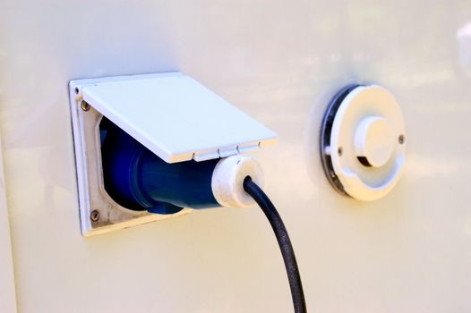 power supply of motor home in a camp-site. Catch connected on the vehicle.