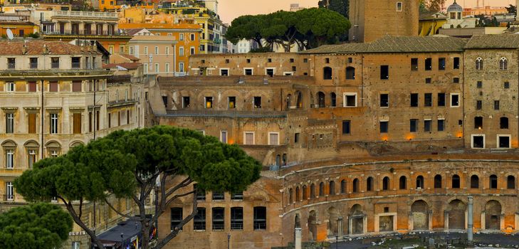 Modern and ancient buildings in Rome at sunset