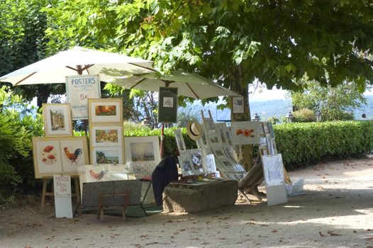 Sale of paintings in a street of Domme