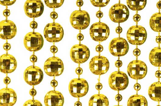 Background made of a brilliant celebratory beads of golden color