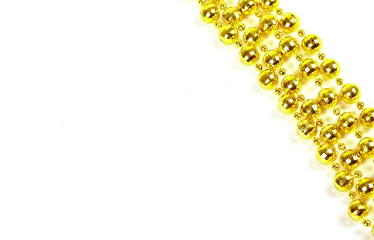 Background made of a brilliant celebratory beads of golden color