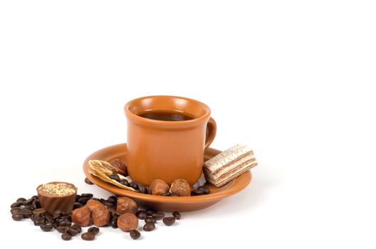 Cup of coffee with ingredients on a white background