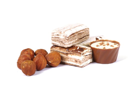 Chocolate and nuts over white