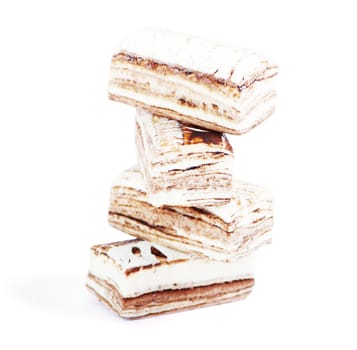 Few pieces of nougat stacked together on white