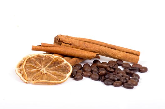 coffee beans, cinnamon and lemon isolated on white