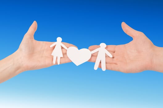 Cutout paper chain family with the protection of cupped hands, concept for security and care