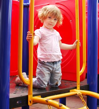 Beauty little girl posing on playground