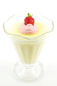 Pudding with strawberry and cream on white