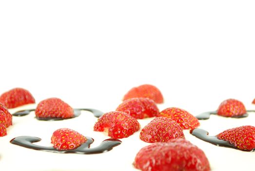 Strawberries with chocolate cream on white background
