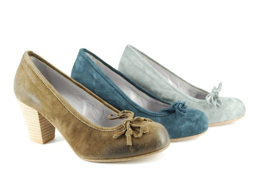 Woman different color shoes on white