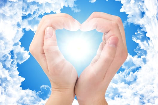 Two hands form a heart shape with their fingers