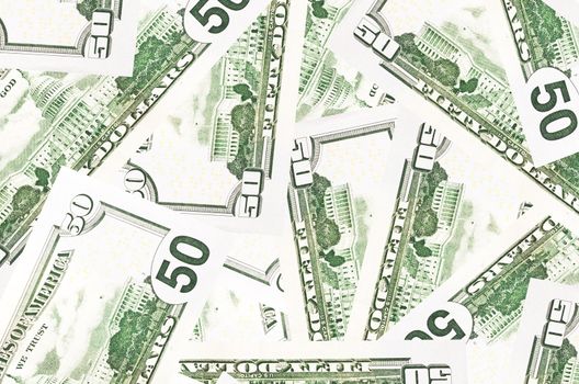 A stack of fifty 50 dollar bills fanned out with the back US Capitol showing on a white background