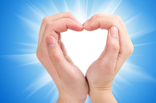 Two hands form a heart shape with their fingers