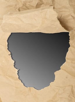 ripped white paper against a black background