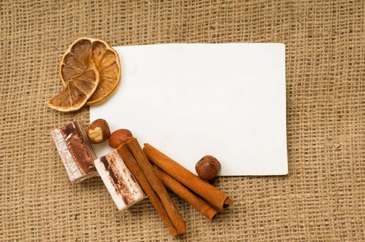 old paper for recipes and spices on burlap closeup