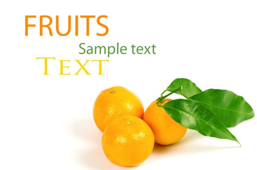 Tangerines with green leaves isolated on white