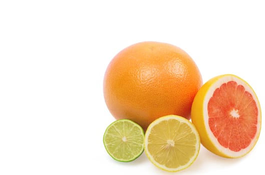 Image of a fresh whole lime, lemon and orange isolated on white