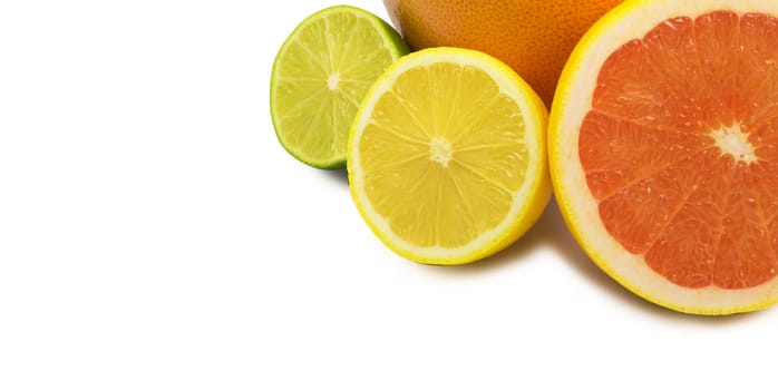 image of a fresh whole lime,lemon and orange isolated on white