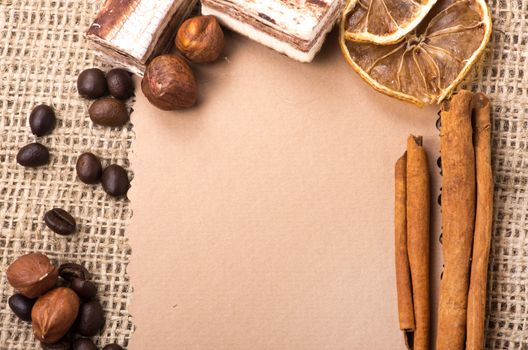 Menu Design. Old paper, coffee bean, cinnamon, lemon, burlap.