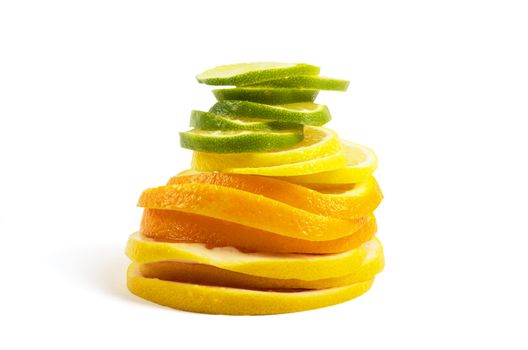 Vitamin C Overload, Stacks of sliced fruit isolated on white
