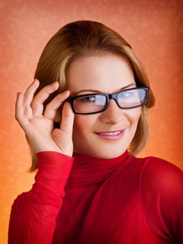 Closeup portrait of a stylish young woman in glasses