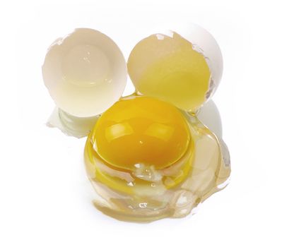 a broken egg on a white background isolated