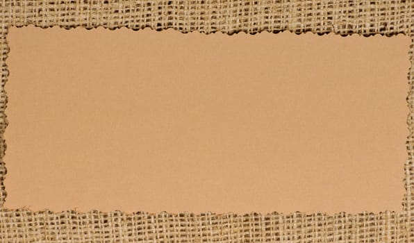 Old paper tag on natural burlap