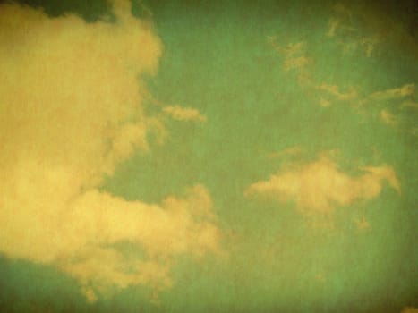 Vintage background in the blue shade with clouds