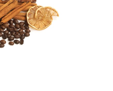 Coffee beans, cinnamon, lemon and sweets over white with a space for Your text