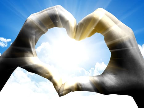 love shape hand silhouette in sky