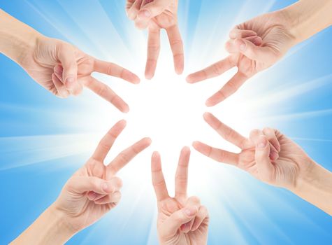 Hands of teamwork , forming the star shape