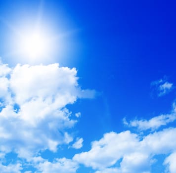 Blue sky with clouds and sun  