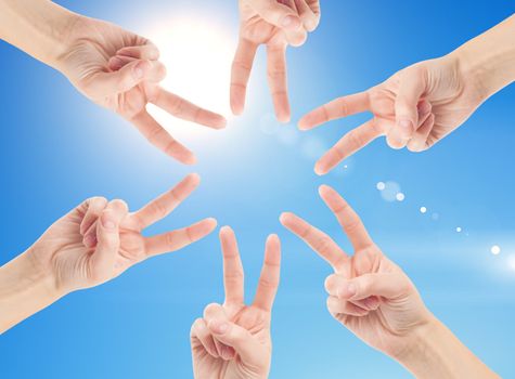 Hands of teamwork , forming the star shape