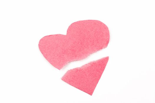 Broken heart shape made of pink paper