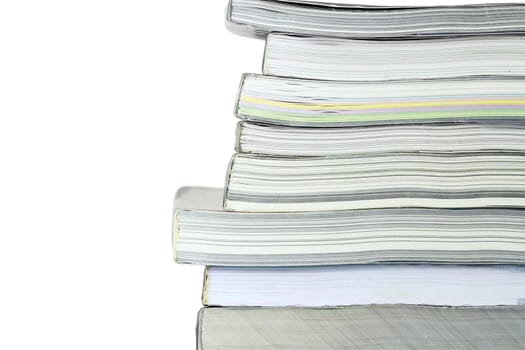 Stack of books on white background, partial view.