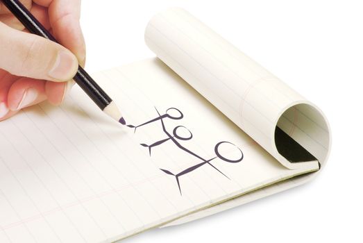 Pencil in hand writing on the notebook