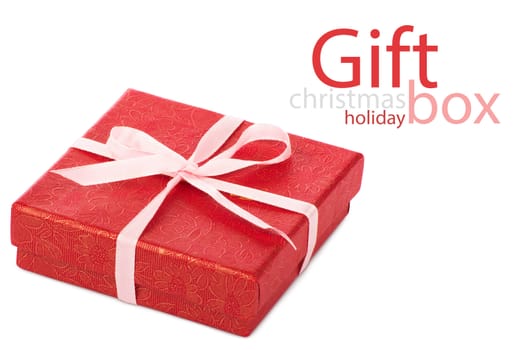 Single red gift box with pink ribbon on white background.