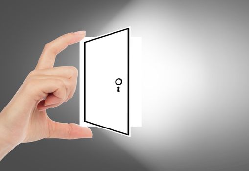 Hand holding an opened door