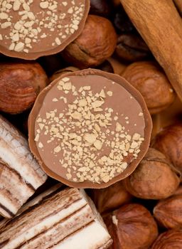 Closeup of coffee beans, cinnamon and nuts