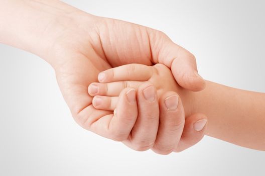 Mother holding child's hand