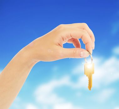 hand holds a gold key