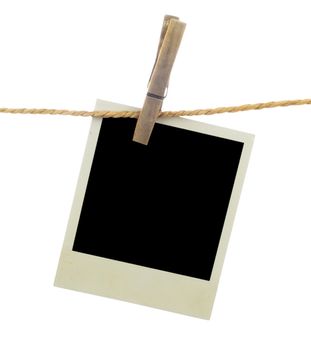 Three blank instant photos hanging on the clothesline. Isolated on white background.