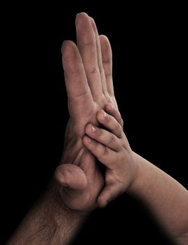 baby hand with father's hand