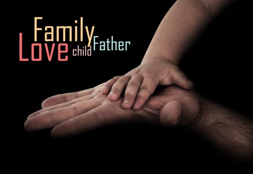 baby hand with father's hand