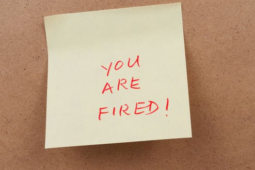 You are fired words on sticky note attached on the board