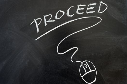 Proceed and mouse symbol drawn on the chalkboard