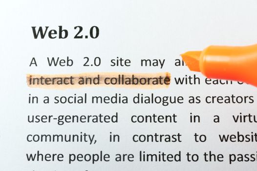 Highlighter and web 2.0 concept words on paper