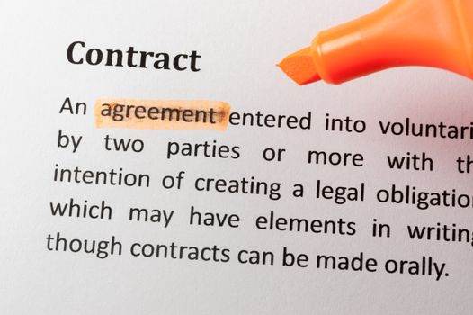 Highlighter and contract item on paper
