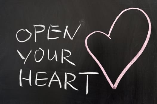 Open your heart concept drawn on chalkboard