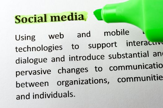 Social media item on paper with a highlighter